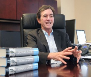 Kevin Kimberlin speaks about his late friend Jonas Salk during an interview in his Greenwich office. Salk, who died in 1995, developed the first successful polio vaccine.